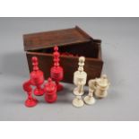 A complete stained and turned bone sectioned chess set, in box (king 3 1/4" high)
