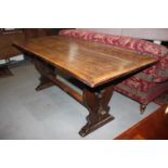 An oak refectory table with planked top, on panel end stretchered supports, 72" wide x 30" deep x
