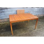 A Bramin teak extending dining table with one extra leaf, on turned supports, 77" long x 36" wide