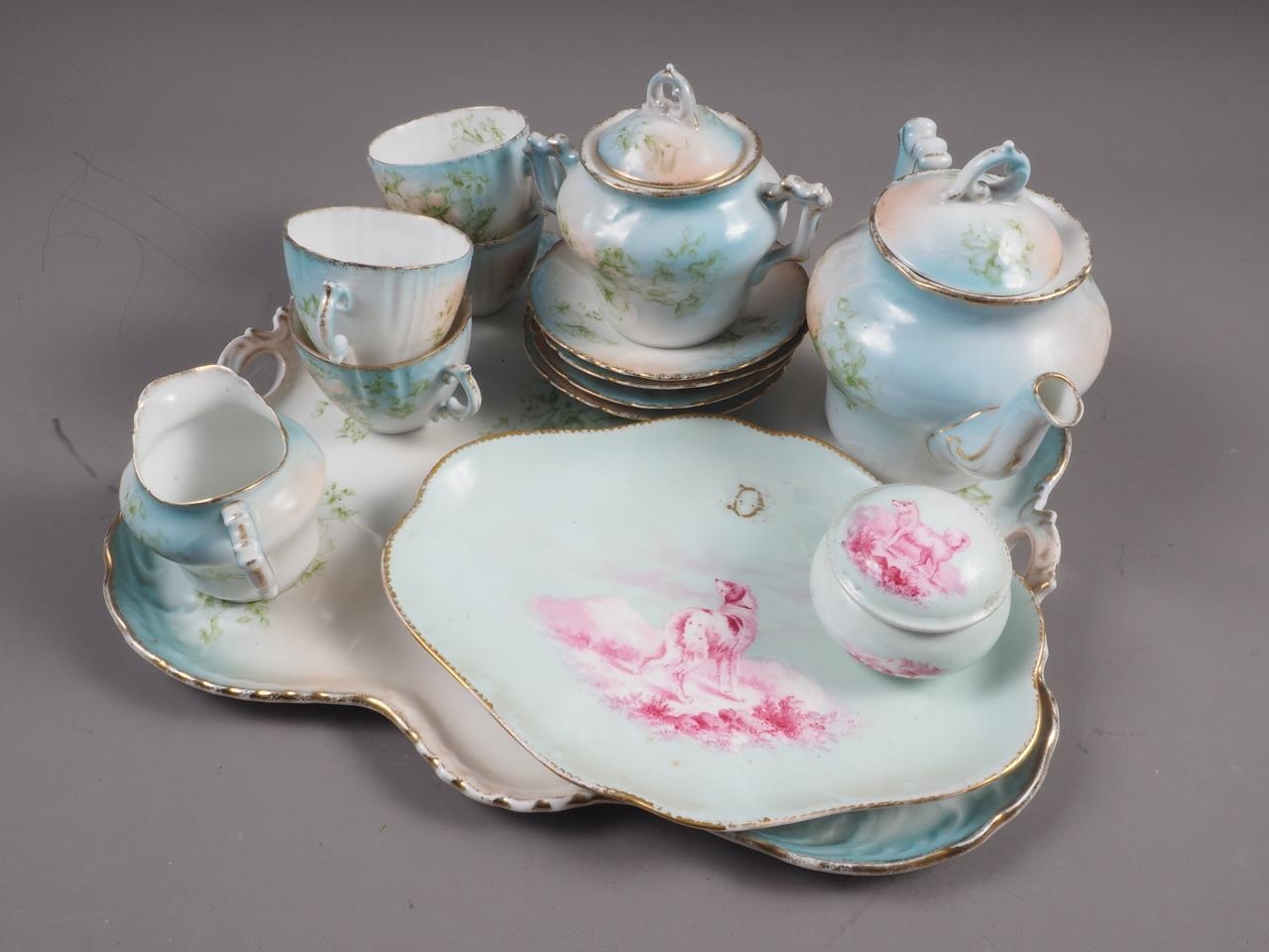 A late 19th century Continental porcelain floral decorated afternoon teaset for four with tray, a