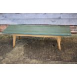 A Westmorland greenstone marble top coffee table, on turned supports, 60" wide x 18" deep x 16" high