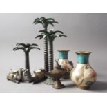 Three patinated palm tree candlesticks, 13" high, a pair of camel candlesticks and other metalwares