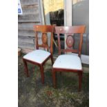 A pair of French style mahogany pierced splat back dining chairs