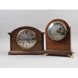 A mahogany arch topped mantel clock with silvered dial and Roman numerals, 8 1/2" high, and a