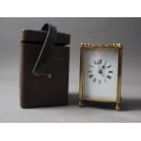 A brass cased carriage clock with travelling case, clock 4 1/2" high