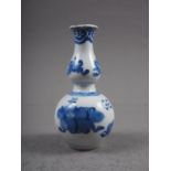 A Chinese blue and white double gourd vase with precious object decoration 5"h (chipped)