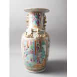 A Chinese Canton vase with relief lizards, decorated panels with figures, precious objects,