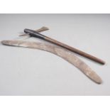 An early Aboriginal stone carved boomerang, 25" wide (one end split) and a Bemba hand-axe with metal
