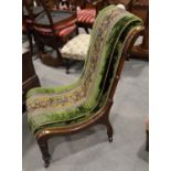 A mahogany framed nursing chair, upholstered in a green floral design beadwork and  velour