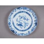 A 19th century Chinese blue and white plate with floral decoration, 11 1/4" dia