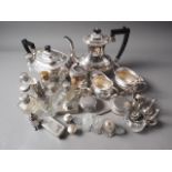 A silver plated four-piece tea and coffee set, a pair of plated rose water bottles, dressing table
