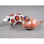 A Royal Crown Derby Imari pheasant, 7" long, and a companion pig, 5" long (no stoppers)