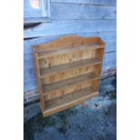 A waxed pine open bookcase, on block base, 38" wide x 18" deep x 39" high, and an oak open bookcase,