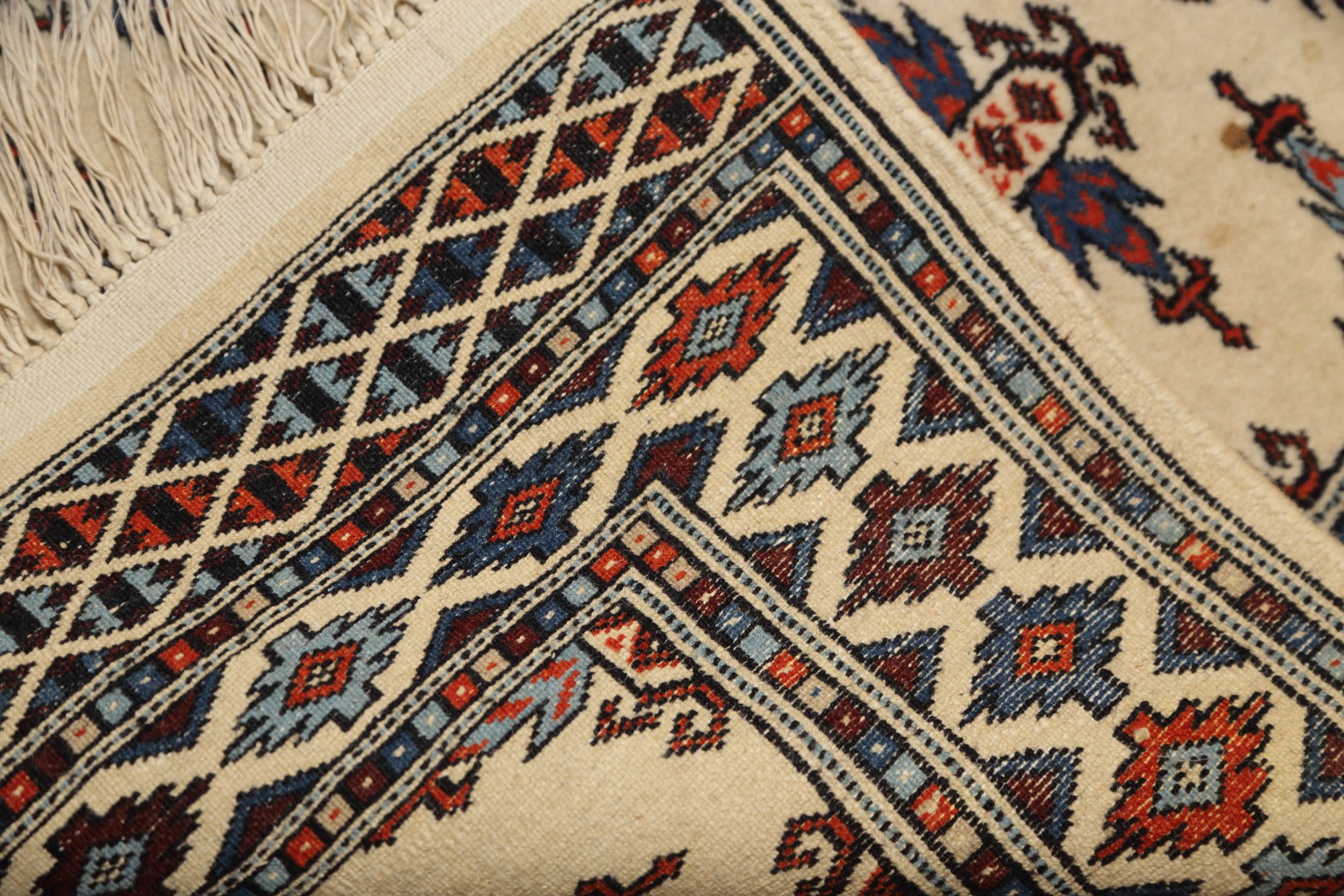A Bokhara rug with twenty-nine hooked guls on a cream ground, 48" x 31" approx - Image 2 of 2