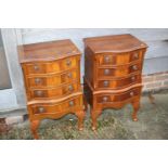 A pair of yew wood miniature bowfront chests of four long drawers, on shell carved cabriole