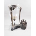 An Egyptian themed bronze candlestick, on black marble, base, 15" high, and a bronzed Egyptian bust,