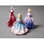 A Royal Doulton figure, "Daisy" HN1575, another, "Marie" HN1370, and a Coalport figure, "Debutant of