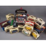An assortment of boxed die-cast model vehicles, including Days Gone models, a Caithness vase, a