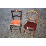A child's polished as mahogany loop back side chair and one other child's chair, on turned and