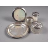 A silver dish with engraved rim, 5 3/4" dia, a silver topped hair tidy, a silver topped dressing