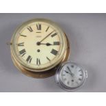 A Smiths Astral brass cased bulkhead clock with enamelled dial and Roman numerals, 10 1/4" dia,