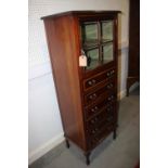 An Edwardian mahogany and satinwood banded music cabinet with glazed door over six drawers, 22" wide