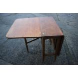 A walnut deep drop leaf dining table, 30" wide x 54" deep x 29" high and a fire screen