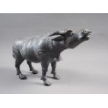 A patinated brass model of a water buffalo, 8" high