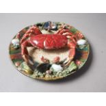 A Palissy style wall plate with relief crab and crustacean decoration, 12 1/4" dia