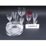 A selection of 19th century and later drinking glasses and three engraved glass bowls