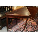 An Edwardian mahogany satinwood banded and box line inlaid triangular fold-over top card table, on
