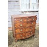 A 19th century mahogany bowfront chest of two short and three long drawers with oval brass handle