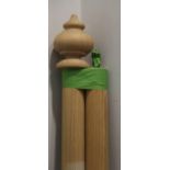 A light oak curtain pole with fittings, 120" long approx, and a polished as walnut curtain pole with
