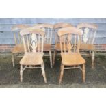 A set of six beech and elm Windsor splat back dining chairs, on turned and stretchered supports