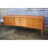 A Bramin teak sideboard, fitted four centre drawers and two cupboards enclosed sliding doors, on