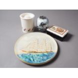 A Gray's Pottery plaque with clipper decoration, 10 3/4" dia, with a Carlton ware Guinness jar and