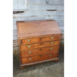A 19th century mahogany fall front bureau, the interior fitted drawers and pigeonholes over four