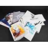 A collection of Swarovski brochures, bags, leaflets, etc