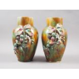 A pair of 19th century Continental pottery vases with blackberry design relief, 9 3/4" high
