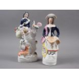 A 19th century Staffordshire porcelain figure of a Highlander with a cockerel and fox seated on