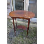 An Edwardian mahogany box and ebony strung kidney-shape two-tier occasional table, on splay