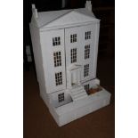 A painted wooden doll's house of Georgian design with basement, 26" wide x 41" high