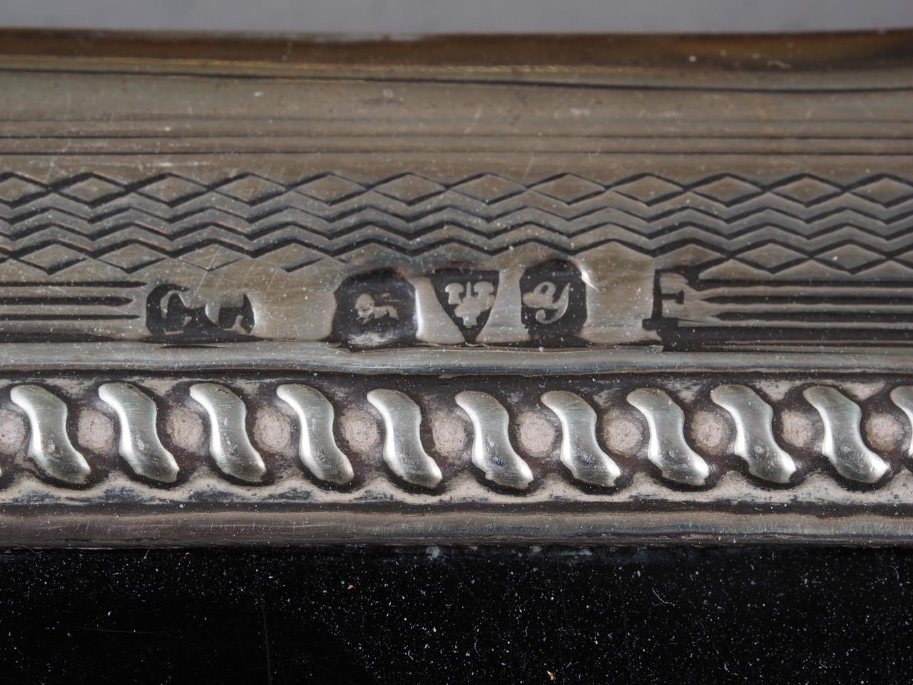 A silver backed dressing table set, comprising four brushes, a comb and a hand mirror - Image 2 of 2