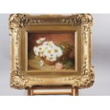 E H Stannard: oil on canvas, still life of daisies in a basket, 8 3/4" x 10 1/4", in ornate gilt