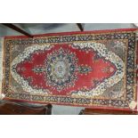 A contour pile rug on a pink ground, 59" x 36" approx, and two Persian design rugs