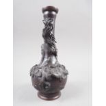A Japanese patinated vase with relief dragon and tree decoration, 7 1/4" high