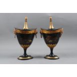 A pair of early 19th century toleware gilt decorated chestnut urns and covers with farm animal
