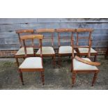 A set of six Regency rosewood bar back standard dining chairs with padded seats, on turned and