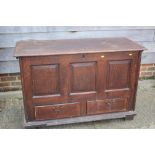 An 18th century oak mule chest with three panel front, over two drawers, on stile supports, 50" wide