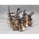 A set of thirteen Mears of London tuned hand bells with leather pegged clappers